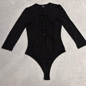 BLACK LACE UP LONG SLEEVE SNAP BODYSUIT